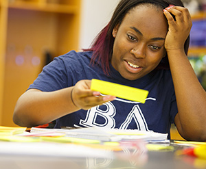 Student putting together her project