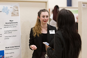 Student explaining her project at undergraduate conference