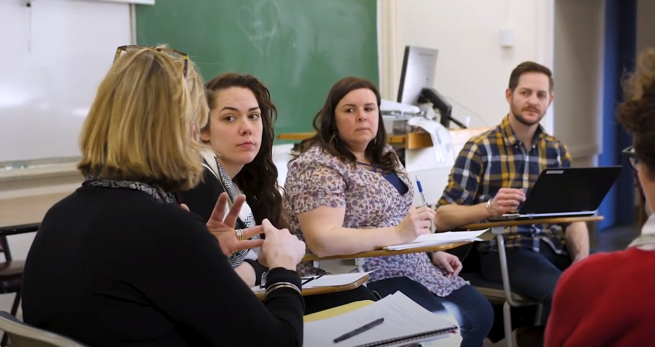 Professor addressing student's questions