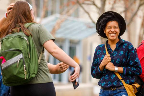 Student smiling on MCLA quad