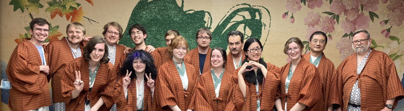 Students and faculty at a formal Japanese banquet