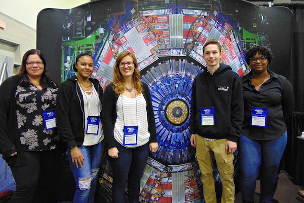 Students and professor at a conference