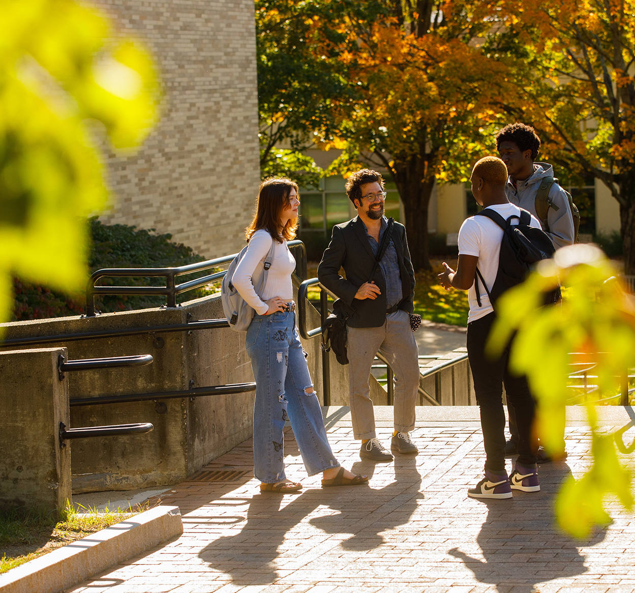 Professor talking to group of students