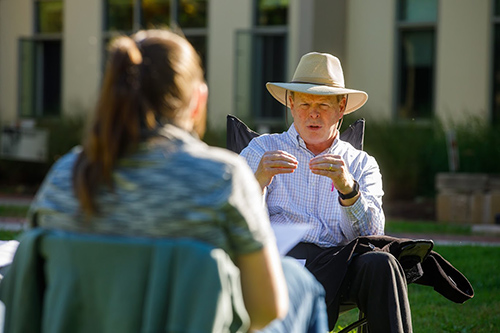 Professor Whalen talking to student