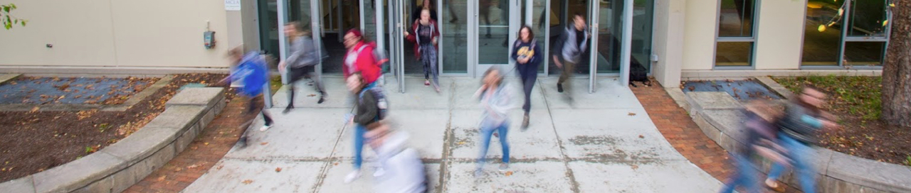 Student coming out of Bowman Hall